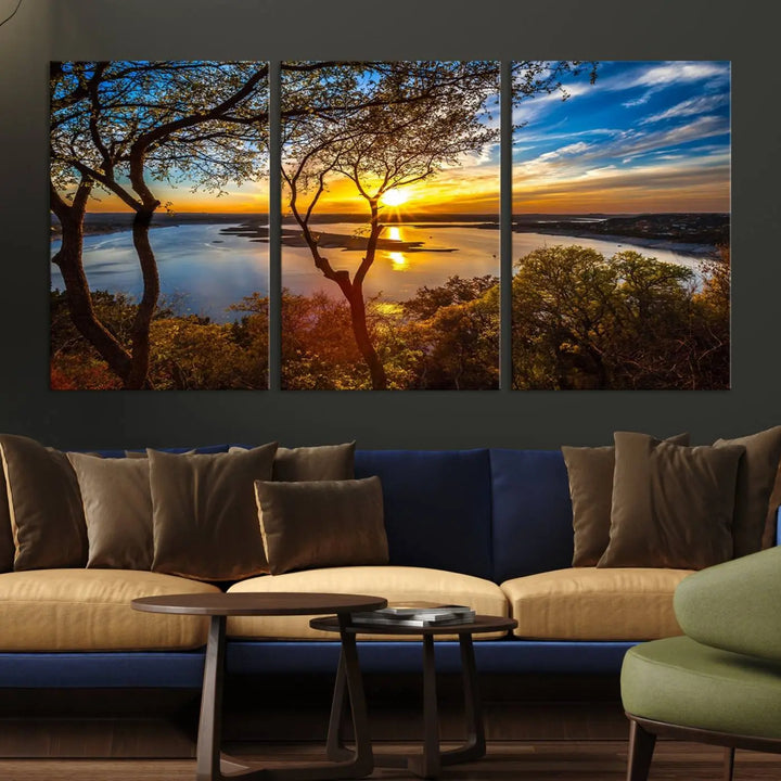 The quad panel nature print titled "Sunrise Over the River Canvas Wall Art" showcases a picturesque sunrise over a river, framed by trees.