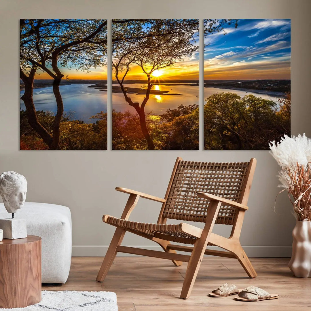 The quad panel nature print titled "Sunrise Over the River Canvas Wall Art" showcases a picturesque sunrise over a river, framed by trees.