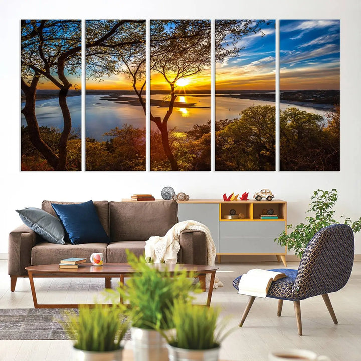 The quad panel nature print titled "Sunrise Over the River Canvas Wall Art" showcases a picturesque sunrise over a river, framed by trees.