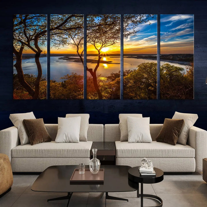 The quad panel nature print titled "Sunrise Over the River Canvas Wall Art" showcases a picturesque sunrise over a river, framed by trees.