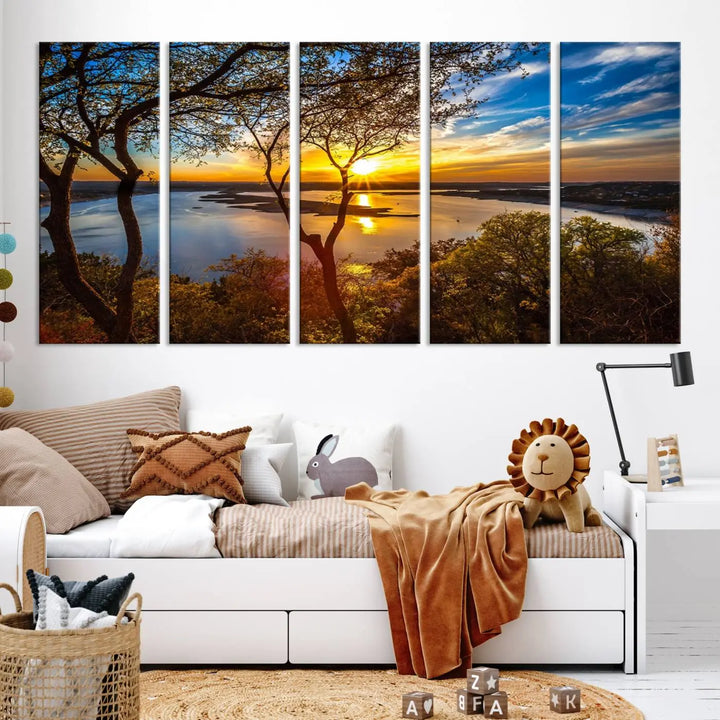 The quad panel nature print titled "Sunrise Over the River Canvas Wall Art" showcases a picturesque sunrise over a river, framed by trees.