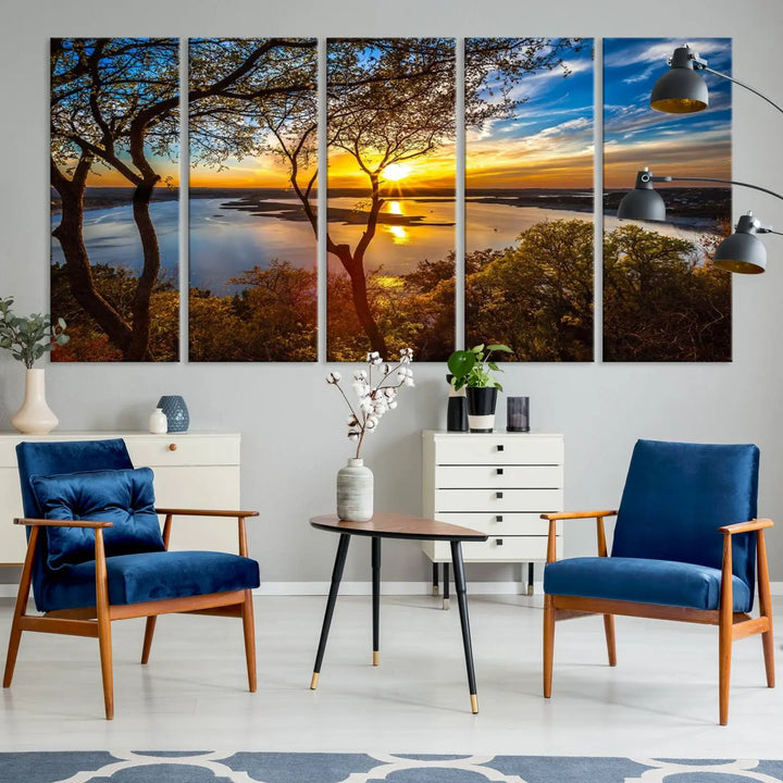 The quad panel nature print titled "Sunrise Over the River Canvas Wall Art" showcases a picturesque sunrise over a river, framed by trees.