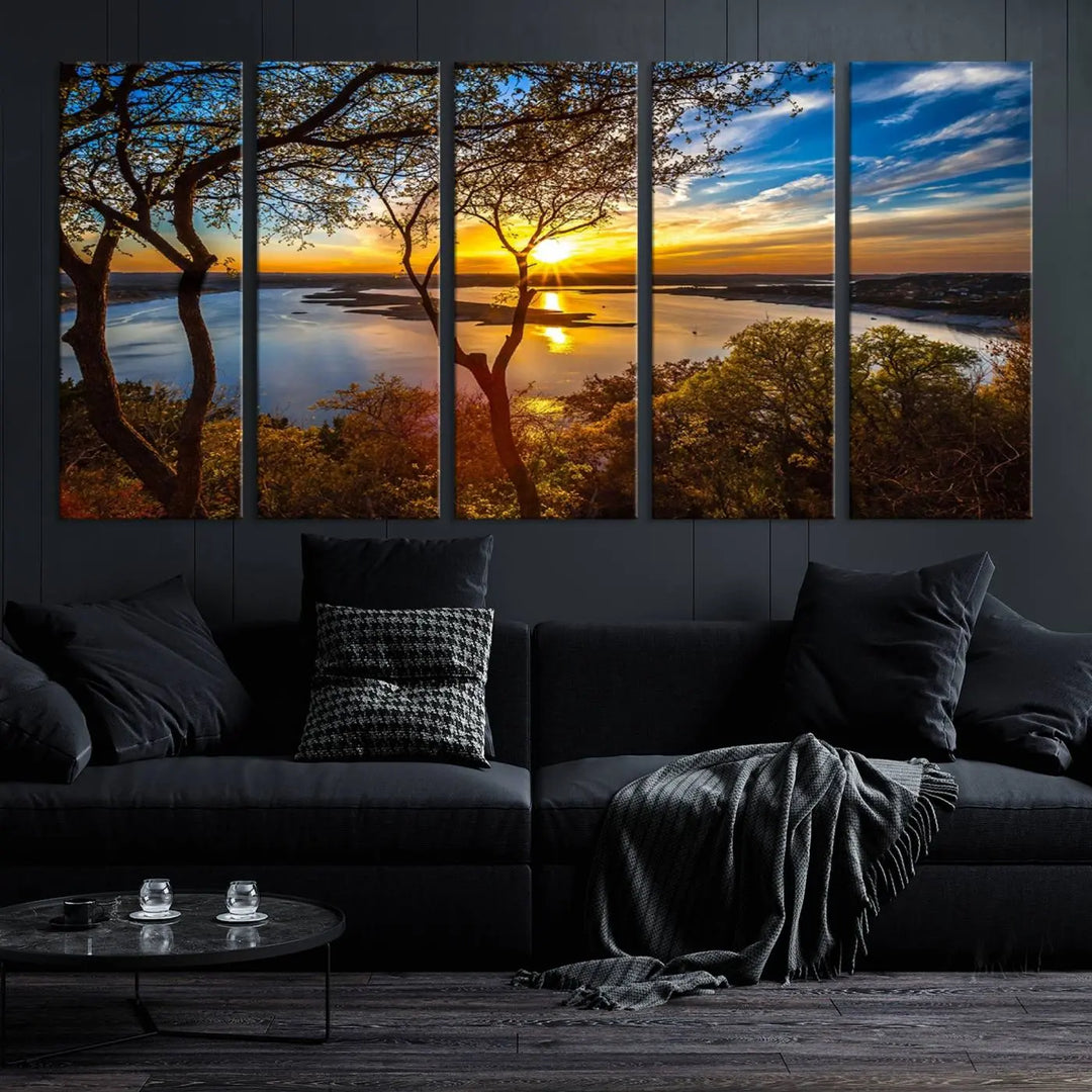 The quad panel nature print titled "Sunrise Over the River Canvas Wall Art" showcases a picturesque sunrise over a river, framed by trees.