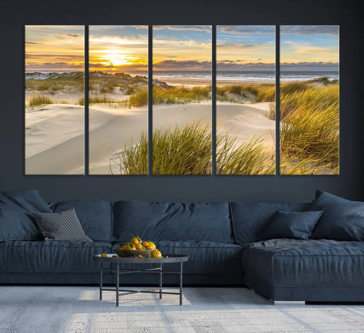 The "Sunrise on The Beach Wall Art Canvas Print" is a set of three museum-quality panels showcasing a beach sunrise with grassy dunes. Each piece includes a UV-protective coating and comes ready to hang for easy installation.