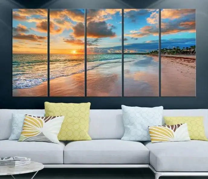 A Sunset Beach Canvas Wall Art—Tropical Triptych Seascape Print embellishes the cozy living room, enhancing the coastal ambiance with its serene ocean sunset.