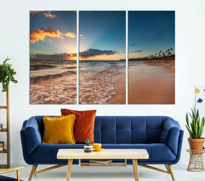 The Sunset Beach Canvas Wall Art, featuring a tropical coastal ocean view in a triptych design, beautifully captures the beach sunset with waves.