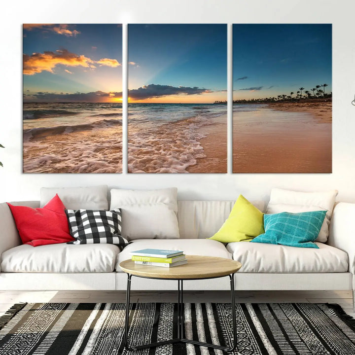 The Sunset Beach Canvas Wall Art, featuring a tropical coastal ocean view in a triptych design, beautifully captures the beach sunset with waves.