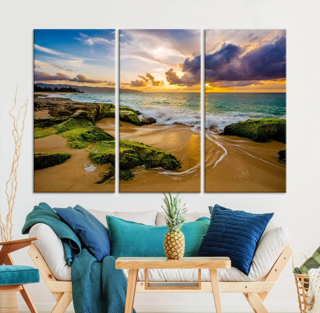 The Sunset Beach Wall Art Canvas Print is a gallery-wrapped triptych showcasing a beach scene with mossy rocks and a vibrant sunset. Made from museum-quality canvas and featuring a UV-protective coating, it elegantly provides both beauty and durability.