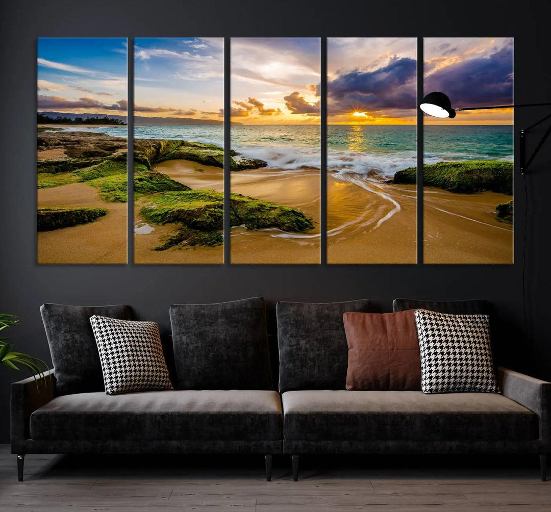 The Sunset Beach Wall Art Canvas Print is a gallery-wrapped triptych showcasing a beach scene with mossy rocks and a vibrant sunset. Made from museum-quality canvas and featuring a UV-protective coating, it elegantly provides both beauty and durability.