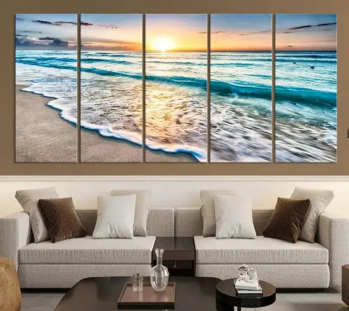 The living room features the Sunset Beach Waves Canvas Wall Art—an ocean sunset print spread over five panels that enhance your space with coastal decor. Cozy, nature-themed elements add warmth and charm to the ambiance.