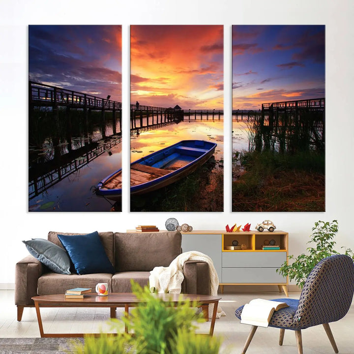 The "Sunset Boat Scene on Lake Triptych" beautifully captures a vibrant sunset over a calm lake. This tranquil scene, featuring serene reflections and surrounded by reeds, is printed on premium giclee canvas with Canon print quality. The gallery wrap design enhances every detail of tranquility.