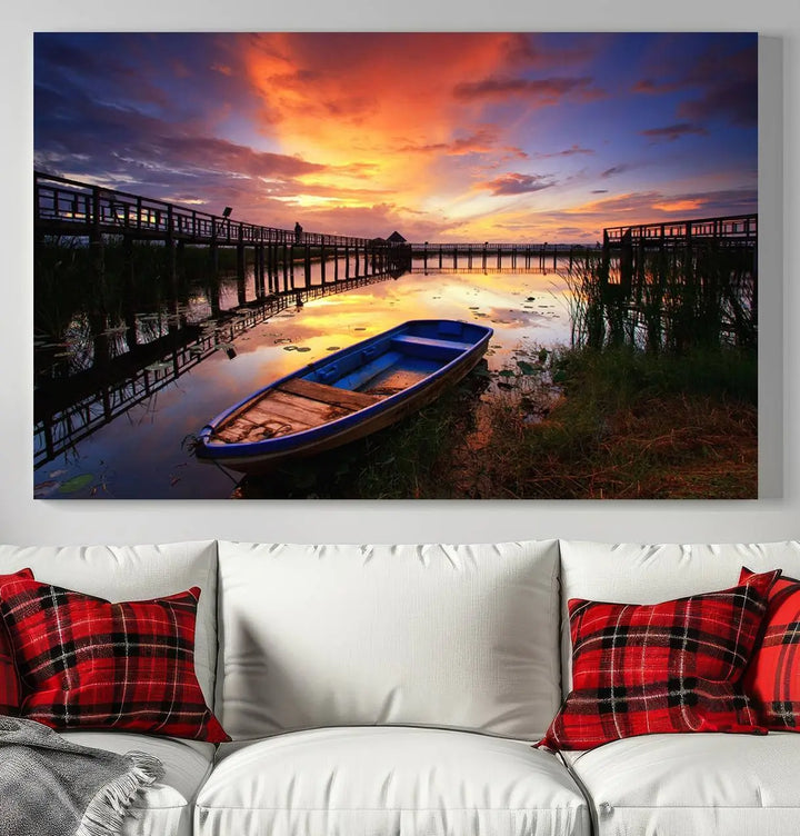 The "Sunset Boat Scene on Lake Triptych" beautifully captures a vibrant sunset over a calm lake. This tranquil scene, featuring serene reflections and surrounded by reeds, is printed on premium giclee canvas with Canon print quality. The gallery wrap design enhances every detail of tranquility.