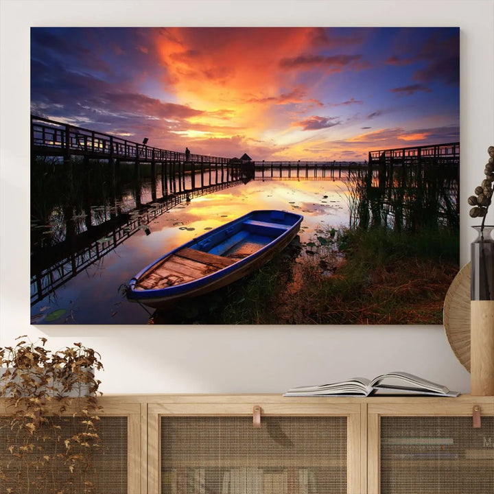 The "Sunset Boat Scene on Lake Triptych" beautifully captures a vibrant sunset over a calm lake. This tranquil scene, featuring serene reflections and surrounded by reeds, is printed on premium giclee canvas with Canon print quality. The gallery wrap design enhances every detail of tranquility.