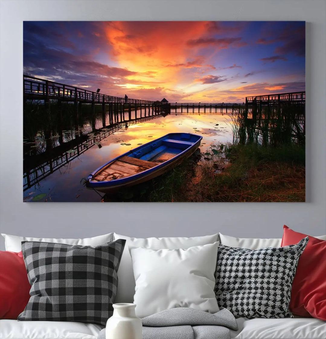 The "Sunset Boat Scene on Lake Triptych" beautifully captures a vibrant sunset over a calm lake. This tranquil scene, featuring serene reflections and surrounded by reeds, is printed on premium giclee canvas with Canon print quality. The gallery wrap design enhances every detail of tranquility.