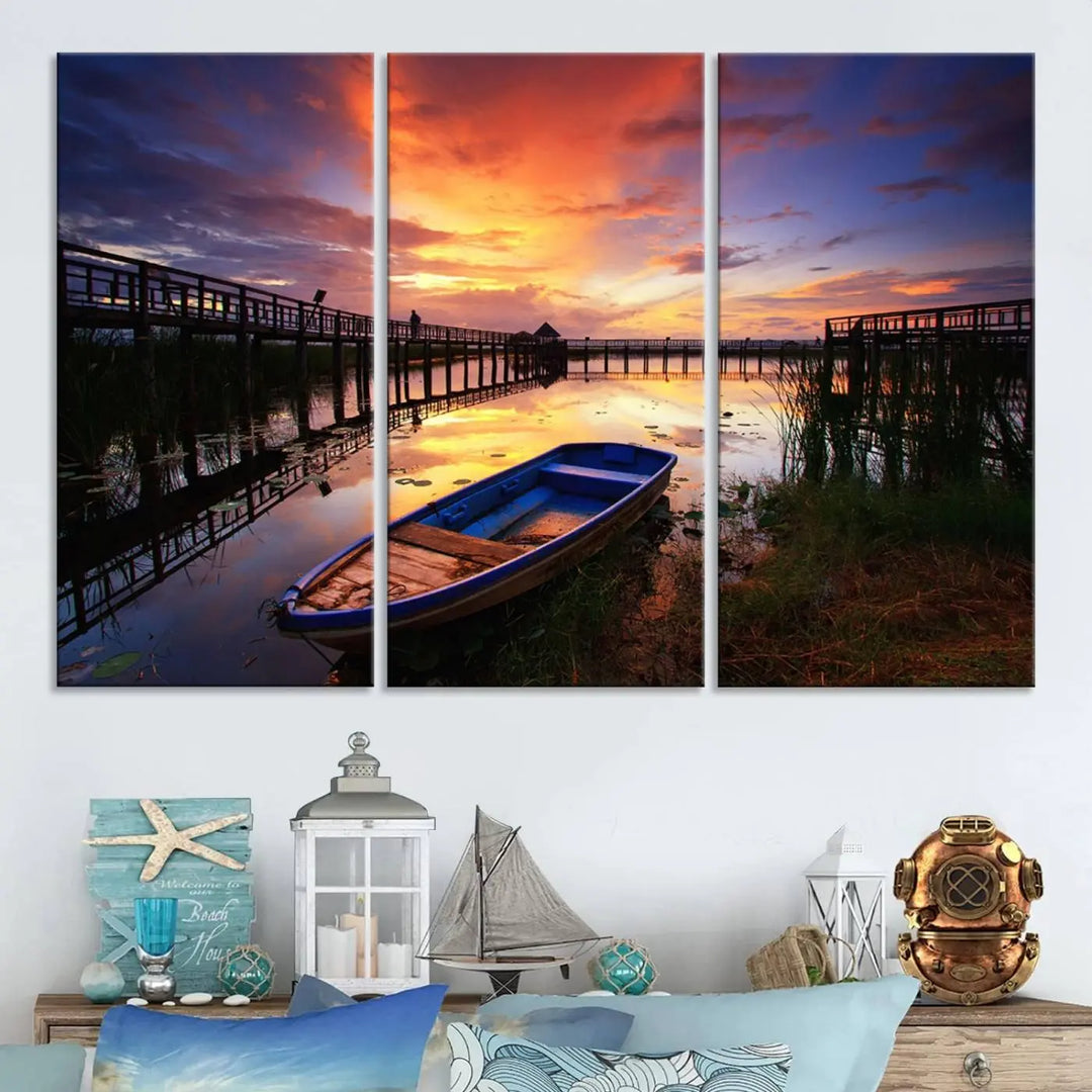 The "Sunset Boat Scene on Lake Triptych" beautifully captures a vibrant sunset over a calm lake. This tranquil scene, featuring serene reflections and surrounded by reeds, is printed on premium giclee canvas with Canon print quality. The gallery wrap design enhances every detail of tranquility.