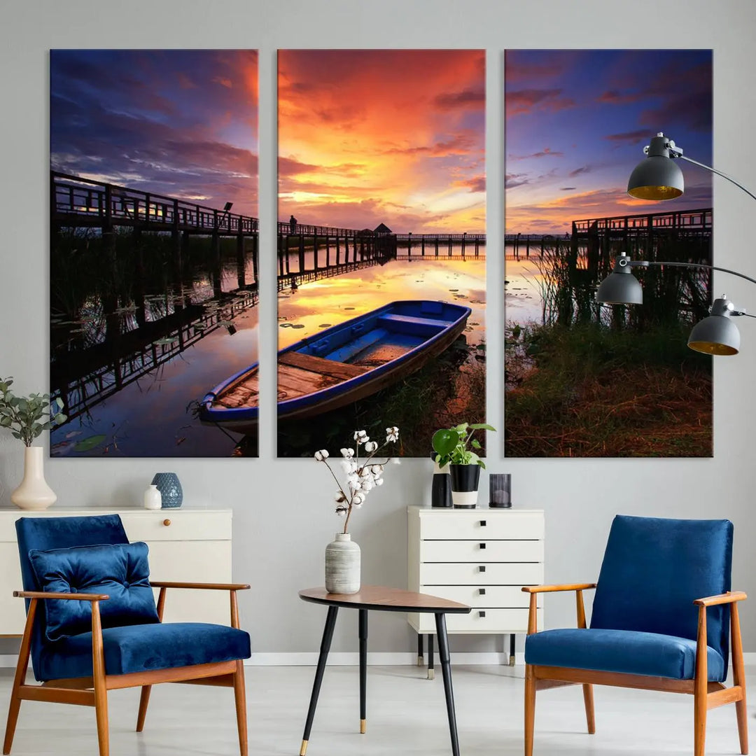 The "Sunset Boat Scene on Lake Triptych" beautifully captures a vibrant sunset over a calm lake. This tranquil scene, featuring serene reflections and surrounded by reeds, is printed on premium giclee canvas with Canon print quality. The gallery wrap design enhances every detail of tranquility.