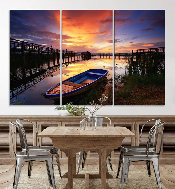 The "Sunset Boat Scene on Lake Triptych" beautifully captures a vibrant sunset over a calm lake. This tranquil scene, featuring serene reflections and surrounded by reeds, is printed on premium giclee canvas with Canon print quality. The gallery wrap design enhances every detail of tranquility.