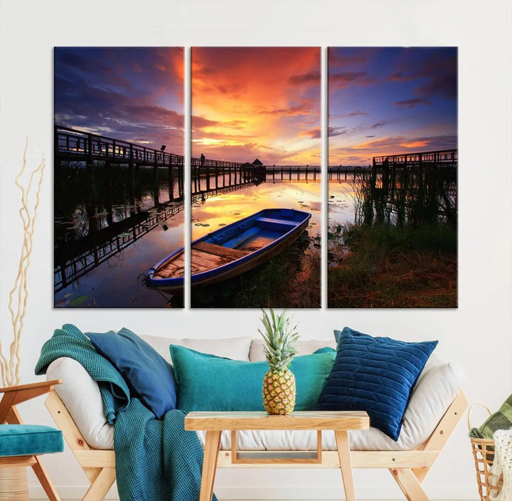 The "Sunset Boat Scene on Lake Triptych" beautifully captures a vibrant sunset over a calm lake. This tranquil scene, featuring serene reflections and surrounded by reeds, is printed on premium giclee canvas with Canon print quality. The gallery wrap design enhances every detail of tranquility.