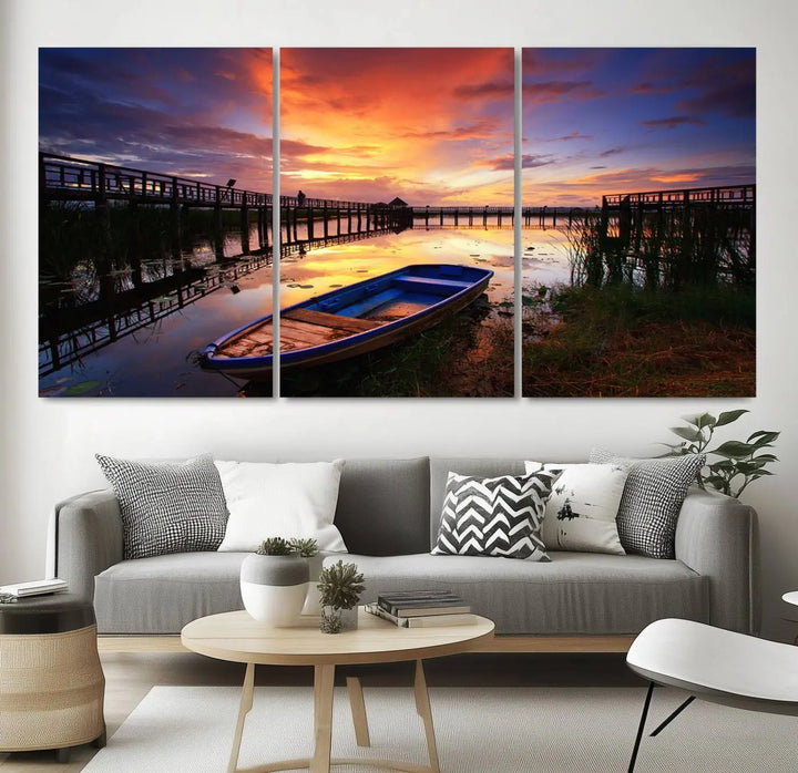 The "Sunset Boat Scene on Lake Triptych" beautifully captures a vibrant sunset over a calm lake. This tranquil scene, featuring serene reflections and surrounded by reeds, is printed on premium giclee canvas with Canon print quality. The gallery wrap design enhances every detail of tranquility.