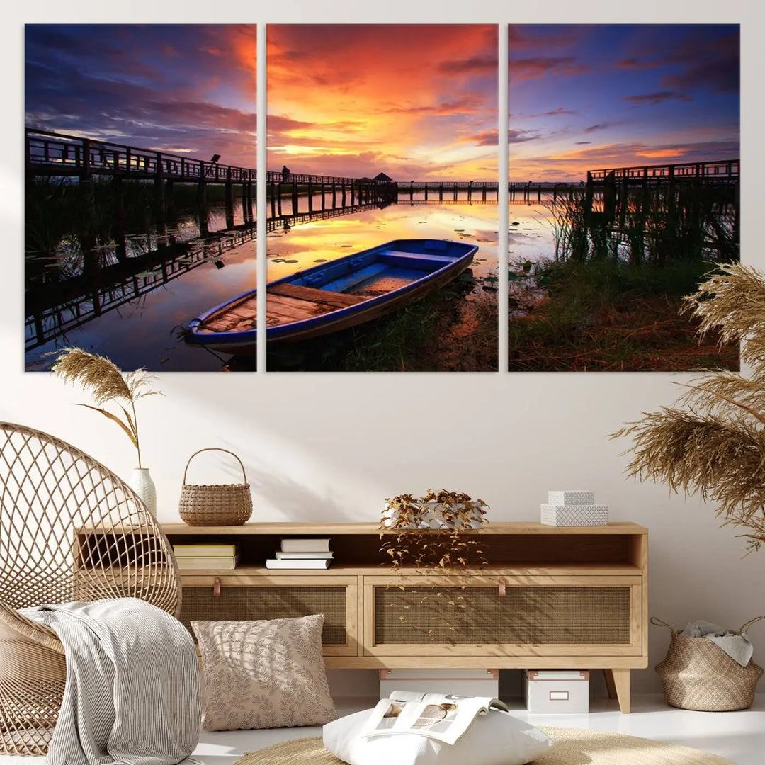 The "Sunset Boat Scene on Lake Triptych" beautifully captures a vibrant sunset over a calm lake. This tranquil scene, featuring serene reflections and surrounded by reeds, is printed on premium giclee canvas with Canon print quality. The gallery wrap design enhances every detail of tranquility.