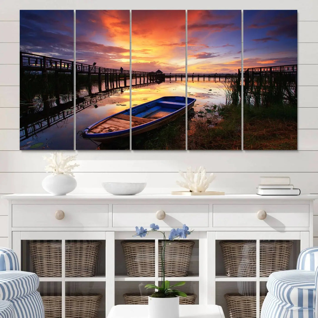 The "Sunset Boat Scene on Lake Triptych" beautifully captures a vibrant sunset over a calm lake. This tranquil scene, featuring serene reflections and surrounded by reeds, is printed on premium giclee canvas with Canon print quality. The gallery wrap design enhances every detail of tranquility.