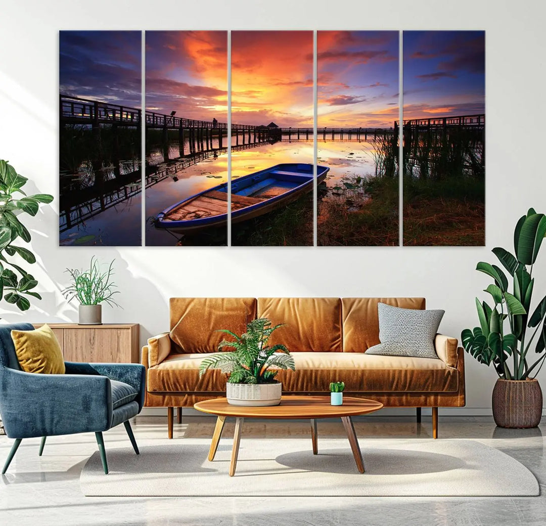 The "Sunset Boat Scene on Lake Triptych" beautifully captures a vibrant sunset over a calm lake. This tranquil scene, featuring serene reflections and surrounded by reeds, is printed on premium giclee canvas with Canon print quality. The gallery wrap design enhances every detail of tranquility.