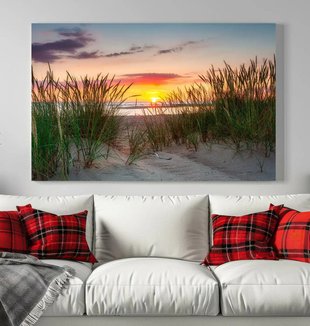 A set of three "Sunset Coastal Beach Wall Art Canvas Prints," featuring a beach sunset with tall grasses, gallery wrapped on museum-quality canvases.