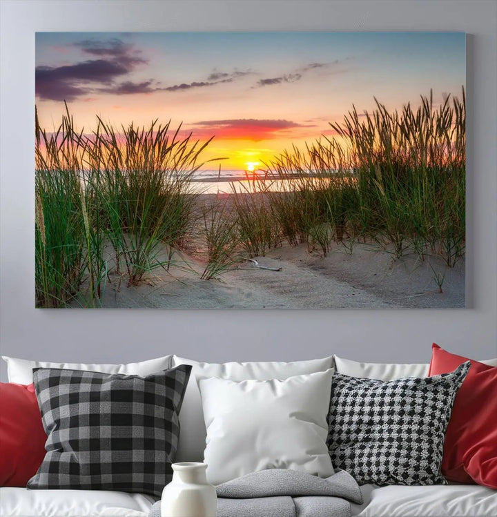 A set of three "Sunset Coastal Beach Wall Art Canvas Prints," featuring a beach sunset with tall grasses, gallery wrapped on museum-quality canvases.