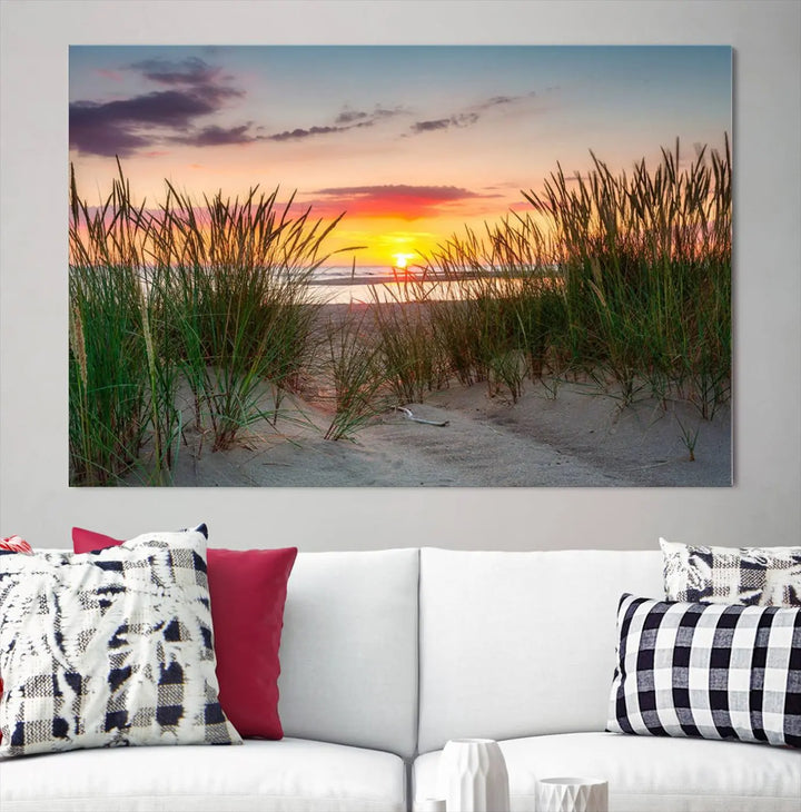 A set of three "Sunset Coastal Beach Wall Art Canvas Prints," featuring a beach sunset with tall grasses, gallery wrapped on museum-quality canvases.