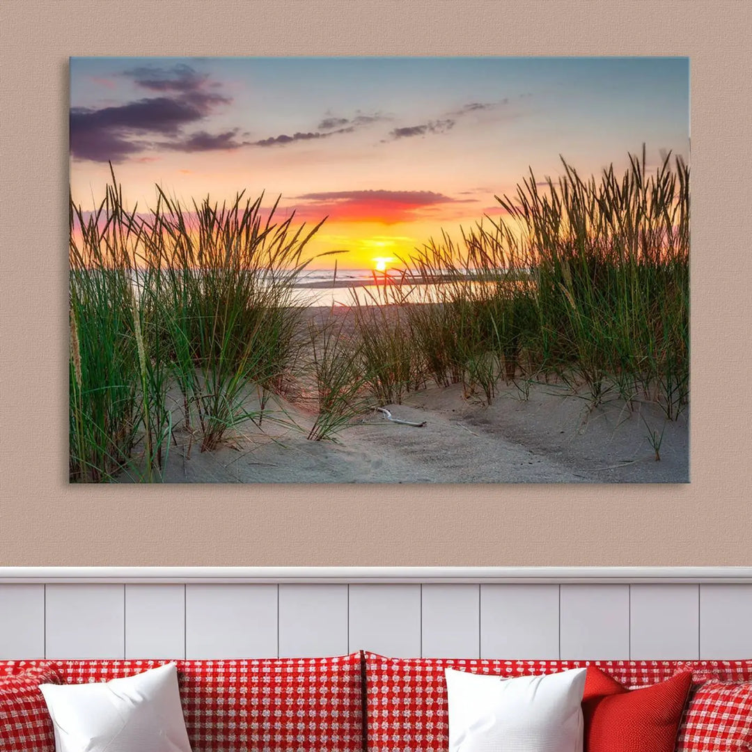 A set of three "Sunset Coastal Beach Wall Art Canvas Prints," featuring a beach sunset with tall grasses, gallery wrapped on museum-quality canvases.