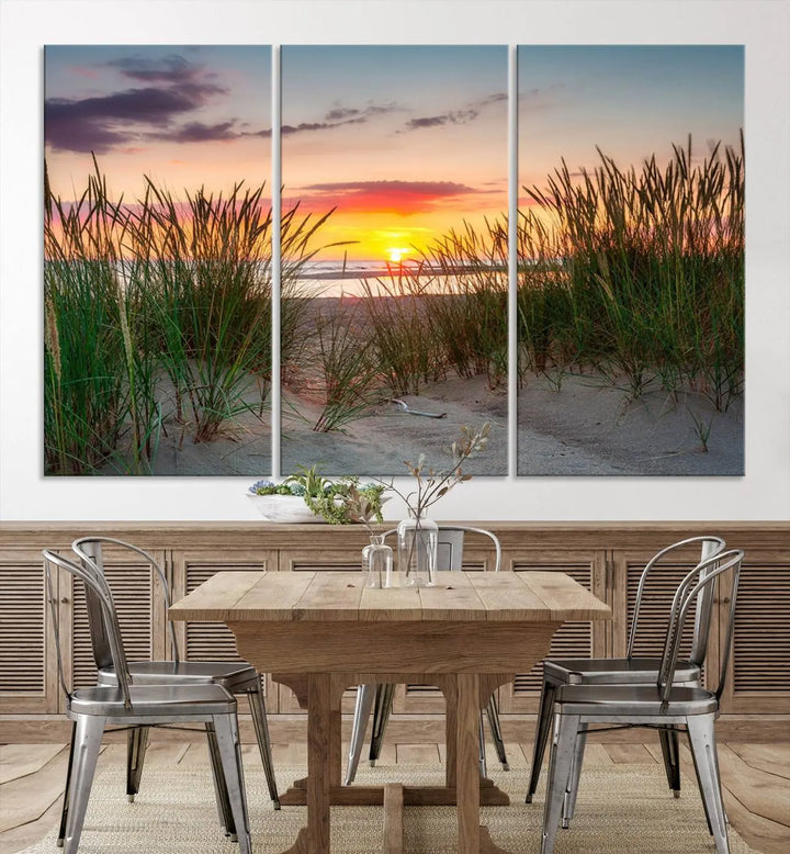 A set of three "Sunset Coastal Beach Wall Art Canvas Prints," featuring a beach sunset with tall grasses, gallery wrapped on museum-quality canvases.