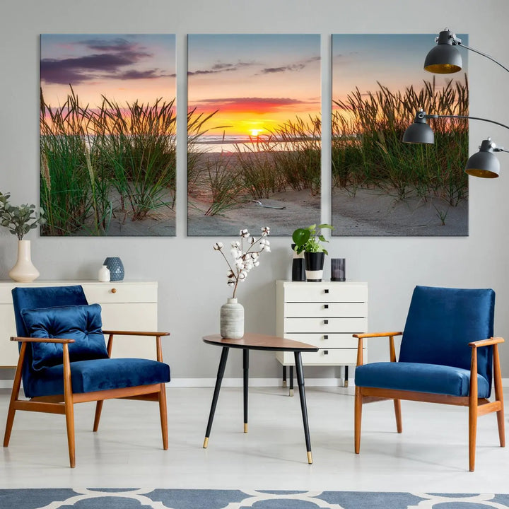 A set of three "Sunset Coastal Beach Wall Art Canvas Prints," featuring a beach sunset with tall grasses, gallery wrapped on museum-quality canvases.