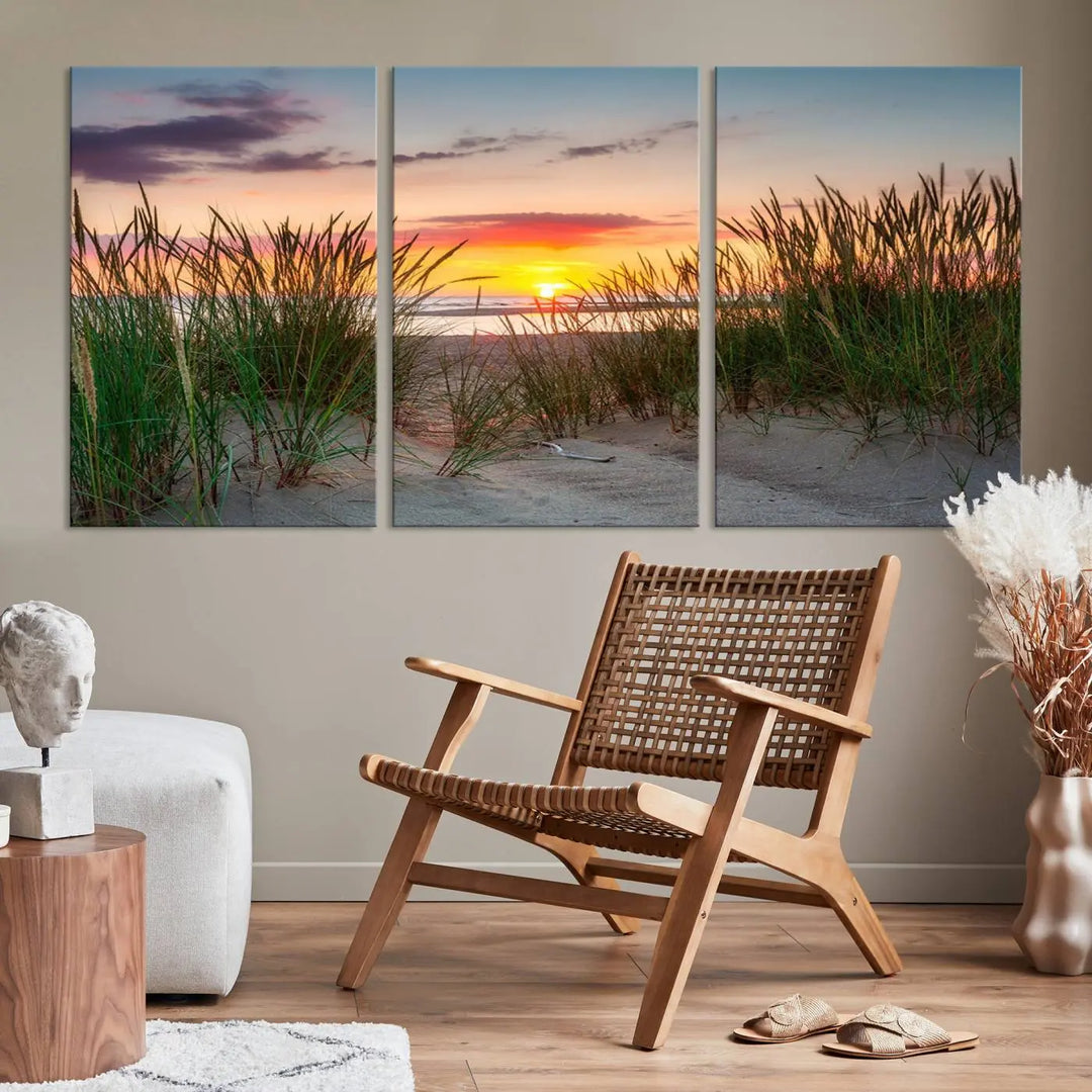 A set of three "Sunset Coastal Beach Wall Art Canvas Prints," featuring a beach sunset with tall grasses, gallery wrapped on museum-quality canvases.