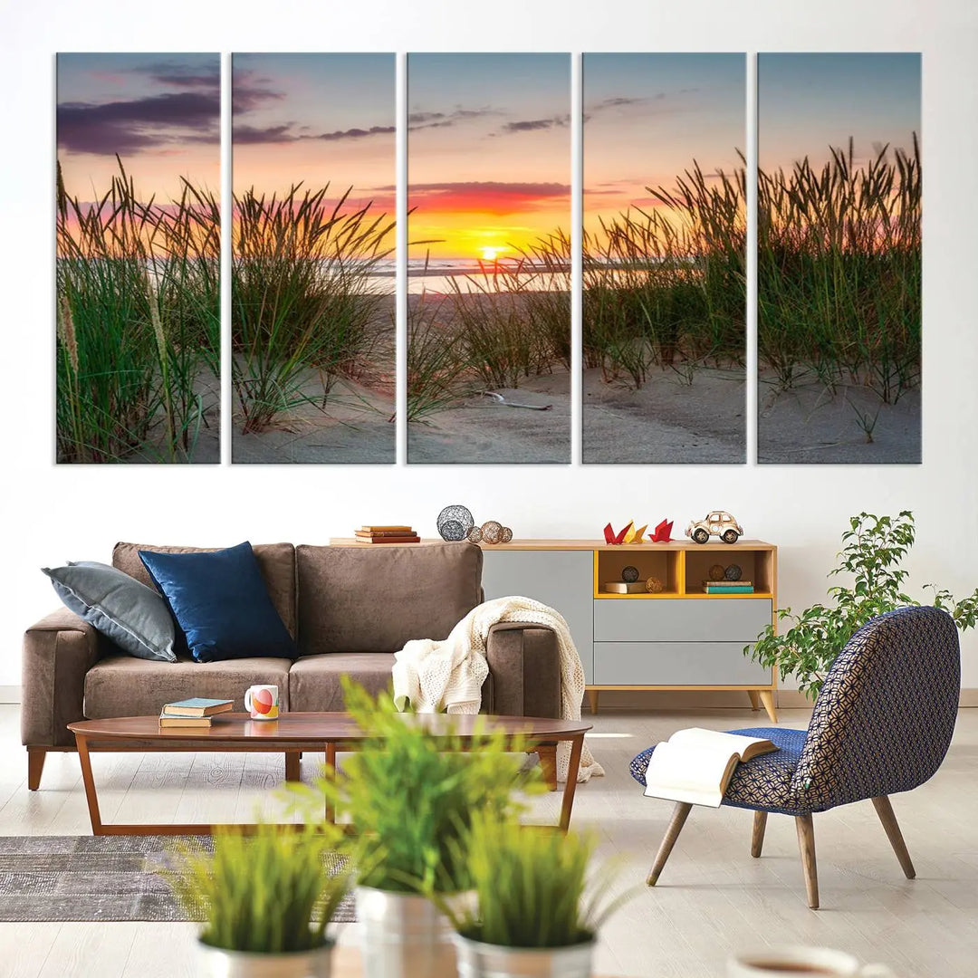 A set of three "Sunset Coastal Beach Wall Art Canvas Prints," featuring a beach sunset with tall grasses, gallery wrapped on museum-quality canvases.