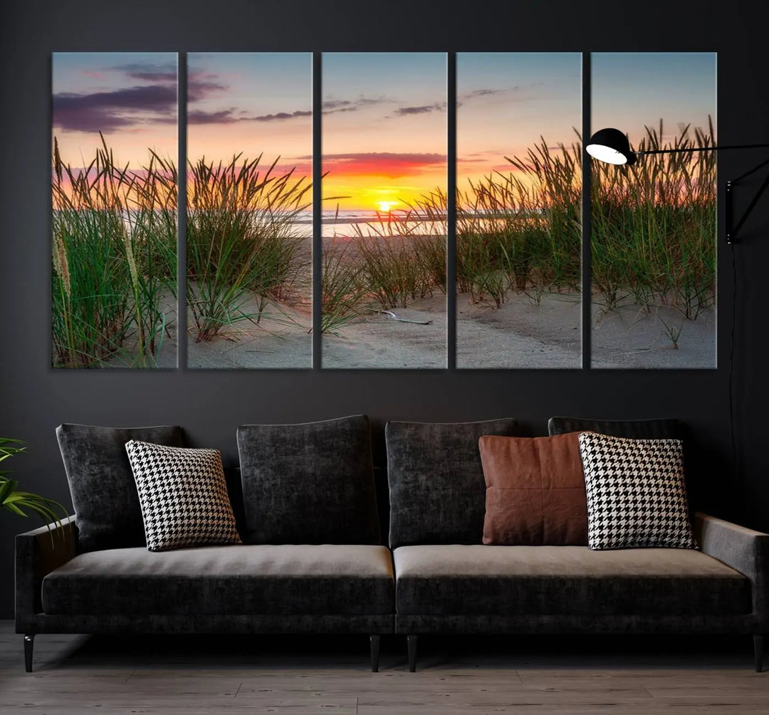 A set of three "Sunset Coastal Beach Wall Art Canvas Prints," featuring a beach sunset with tall grasses, gallery wrapped on museum-quality canvases.