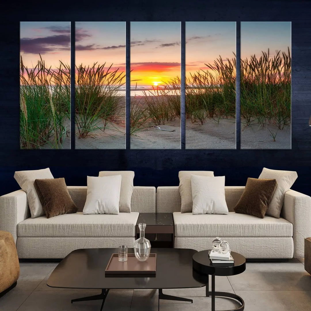 A set of three "Sunset Coastal Beach Wall Art Canvas Prints," featuring a beach sunset with tall grasses, gallery wrapped on museum-quality canvases.