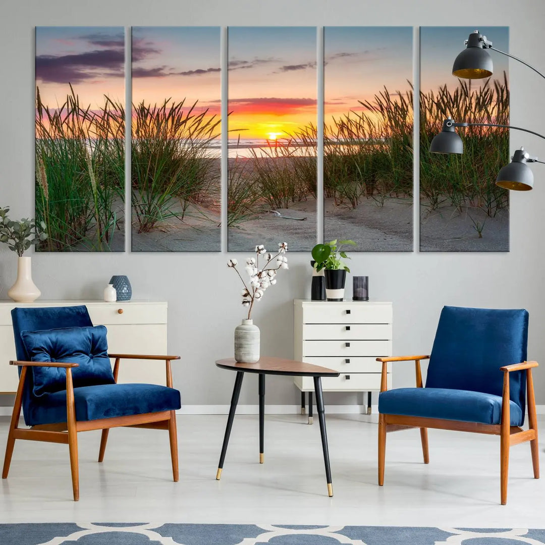 A set of three "Sunset Coastal Beach Wall Art Canvas Prints," featuring a beach sunset with tall grasses, gallery wrapped on museum-quality canvases.