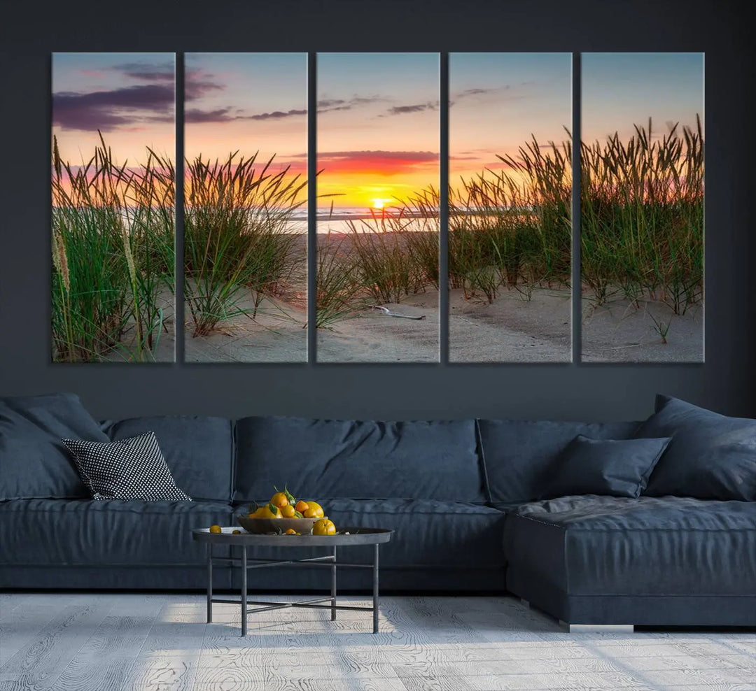 A set of three "Sunset Coastal Beach Wall Art Canvas Prints," featuring a beach sunset with tall grasses, gallery wrapped on museum-quality canvases.