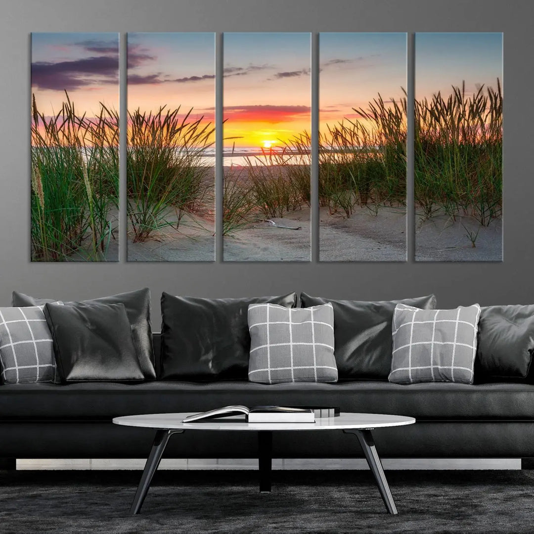 A set of three "Sunset Coastal Beach Wall Art Canvas Prints," featuring a beach sunset with tall grasses, gallery wrapped on museum-quality canvases.