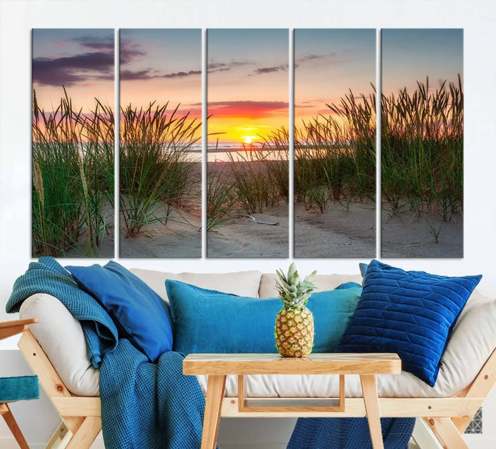 A set of three "Sunset Coastal Beach Wall Art Canvas Prints," featuring a beach sunset with tall grasses, gallery wrapped on museum-quality canvases.