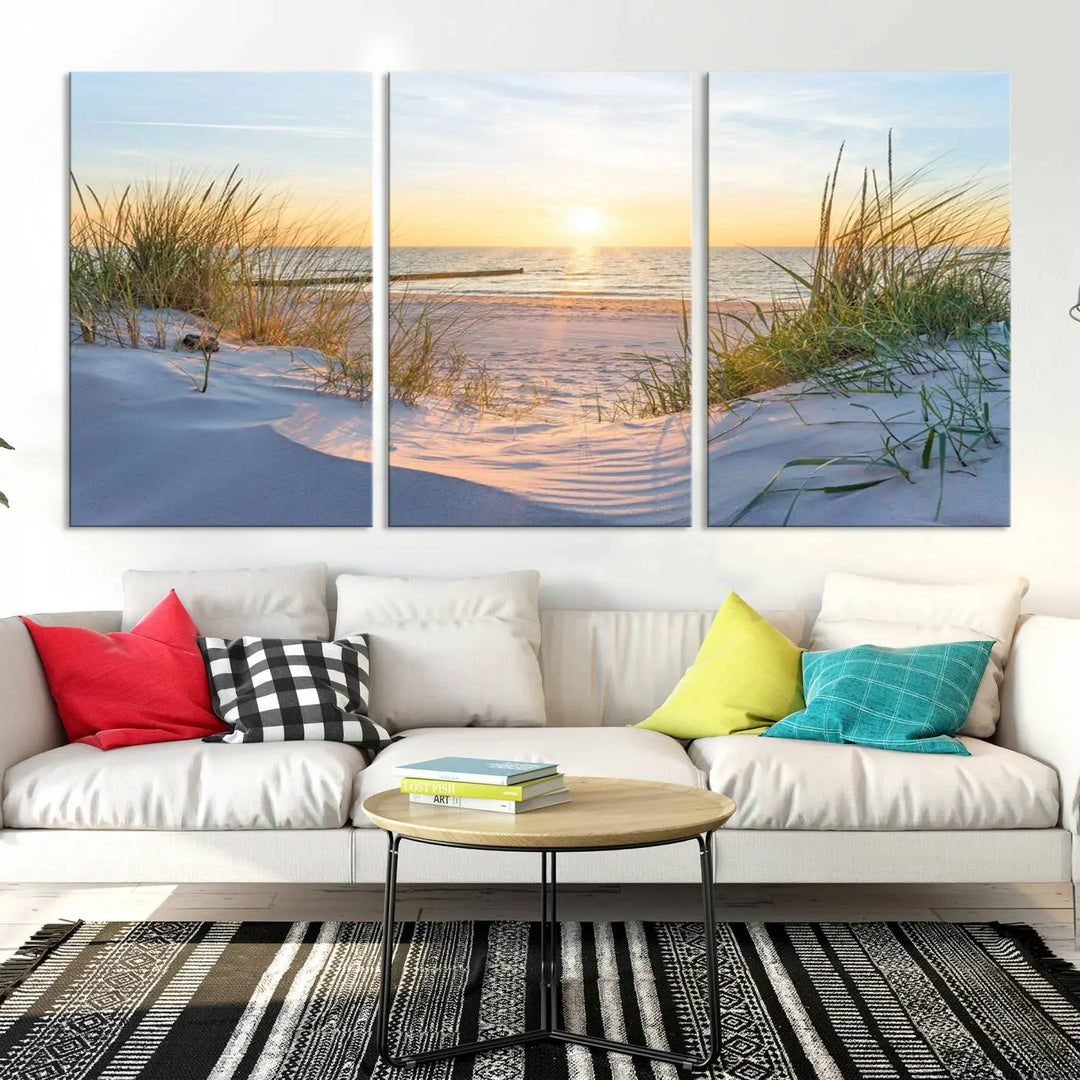 The Sunset Ocean View Beach Canvas Print Artwork, consisting of three panels depicting a tranquil beach sunset, is printed on museum-quality canvas with a UV-protective coating. Free shipping is available for an effortlessly elegant home transformation.