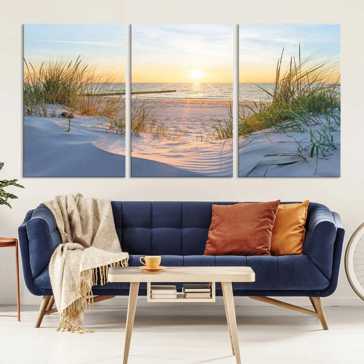 The Sunset Ocean View Beach Canvas Print Artwork, consisting of three panels depicting a tranquil beach sunset, is printed on museum-quality canvas with a UV-protective coating. Free shipping is available for an effortlessly elegant home transformation.