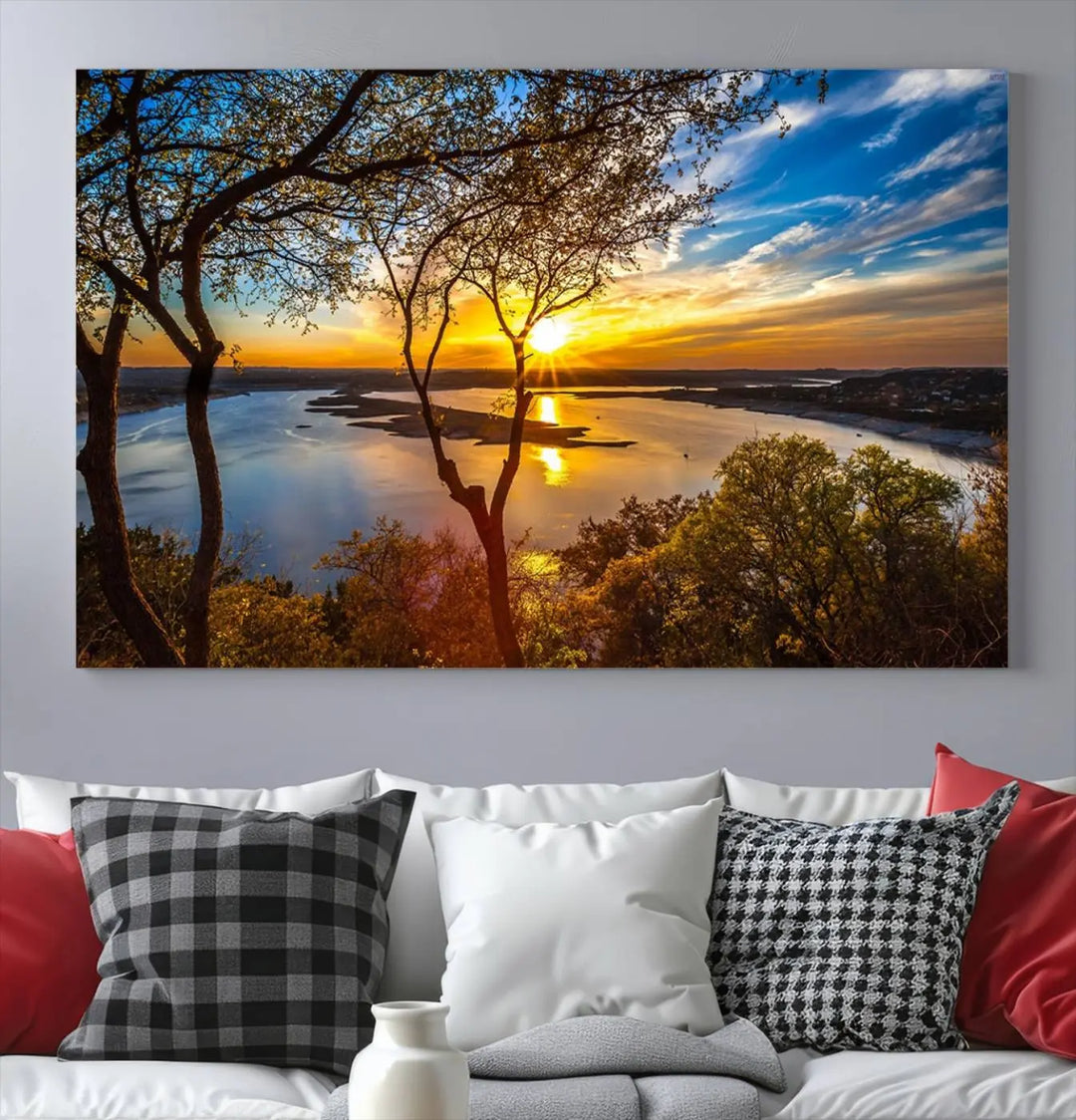 The "Sunset On The Lake Wall Art Canvas Print," featuring a vibrant sunset over a lake, is expertly crafted on museum-quality canvas and comes ready to hang. Its UV-protective coating ensures the colors stay as vivid as when they were first framed.