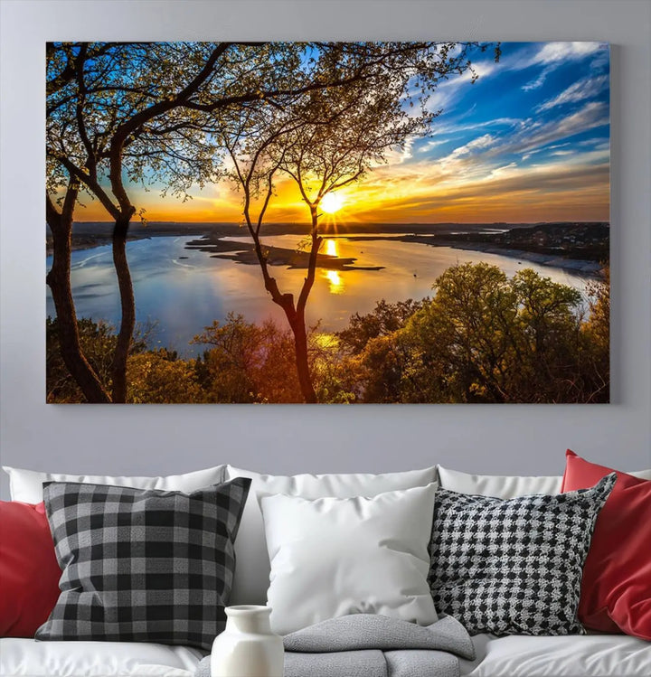 The "Sunset On The Lake Wall Art Canvas Print," featuring a vibrant sunset over a lake, is expertly crafted on museum-quality canvas and comes ready to hang. Its UV-protective coating ensures the colors stay as vivid as when they were first framed.