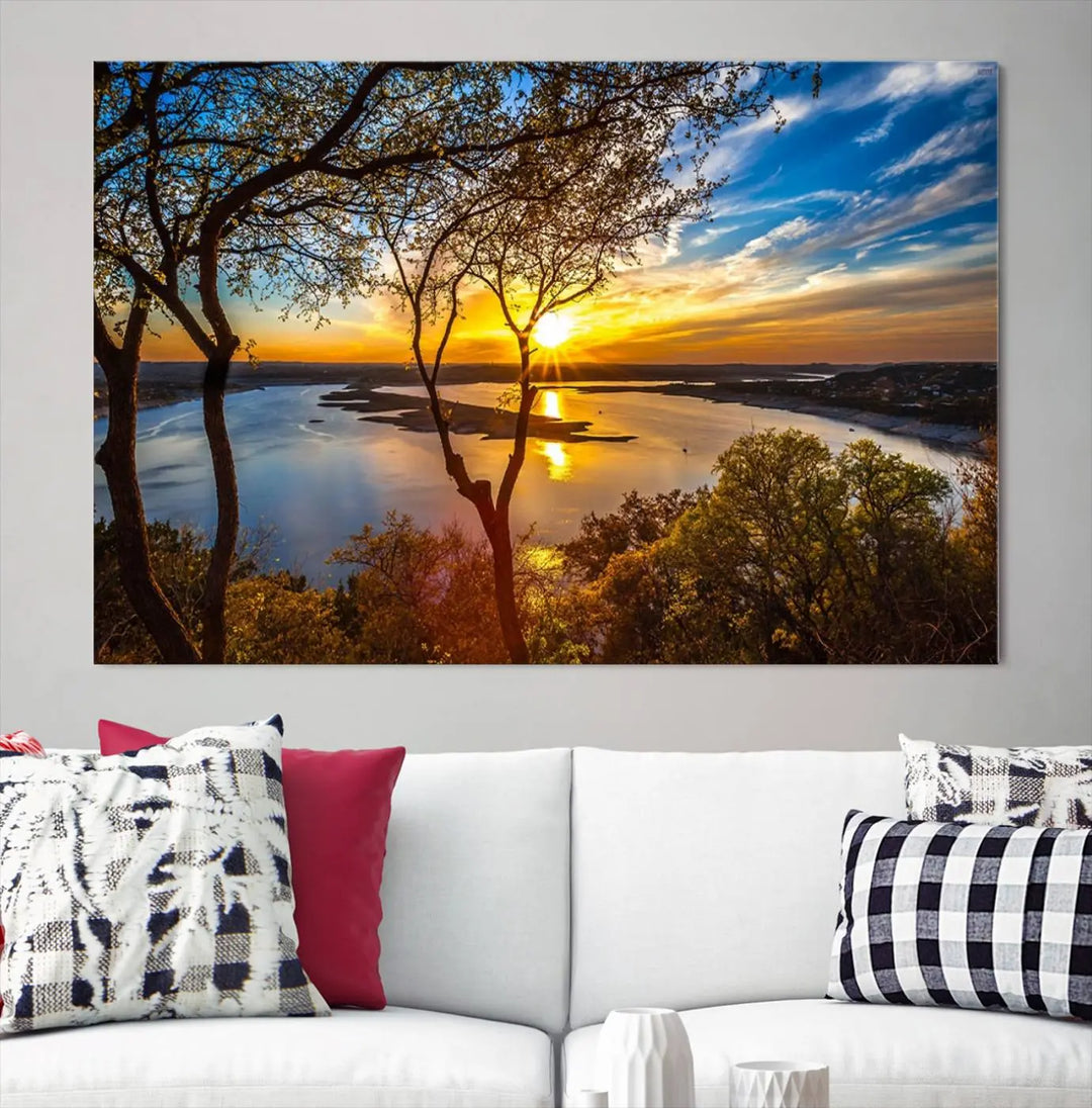 The "Sunset On The Lake Wall Art Canvas Print," featuring a vibrant sunset over a lake, is expertly crafted on museum-quality canvas and comes ready to hang. Its UV-protective coating ensures the colors stay as vivid as when they were first framed.