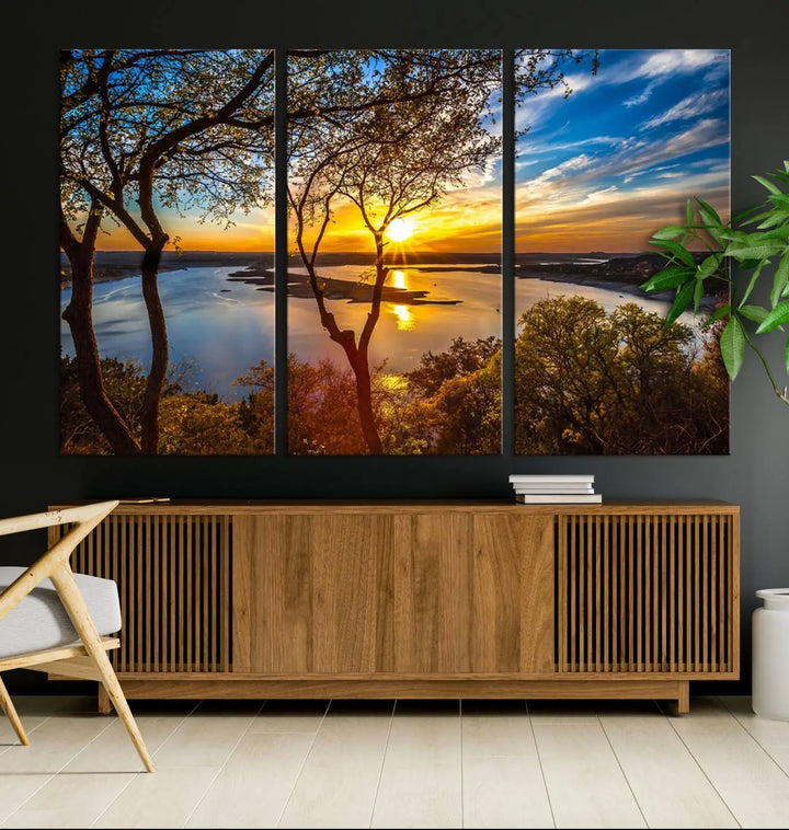 The "Sunset On The Lake Wall Art Canvas Print," featuring a vibrant sunset over a lake, is expertly crafted on museum-quality canvas and comes ready to hang. Its UV-protective coating ensures the colors stay as vivid as when they were first framed.