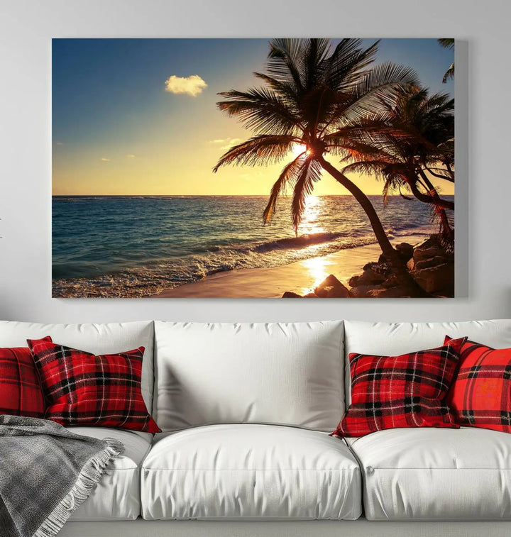 The Sunset Palm Trees Wall Art Canvas Print, a triptych masterpiece depicting a tropical beach sunset with palm trees, is expertly displayed on museum-quality canvases.