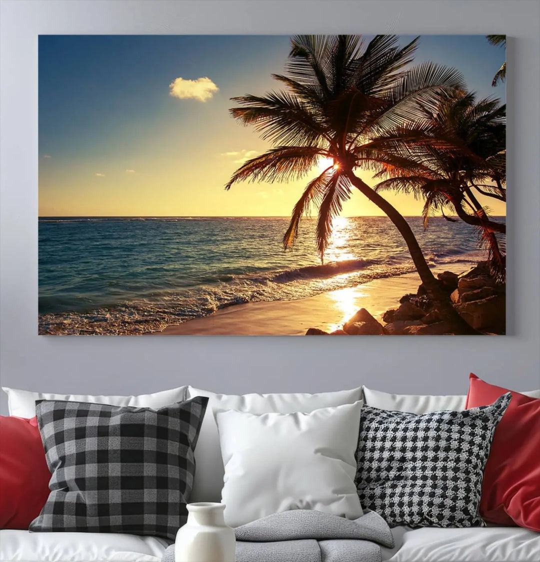 The Sunset Palm Trees Wall Art Canvas Print, a triptych masterpiece depicting a tropical beach sunset with palm trees, is expertly displayed on museum-quality canvases.