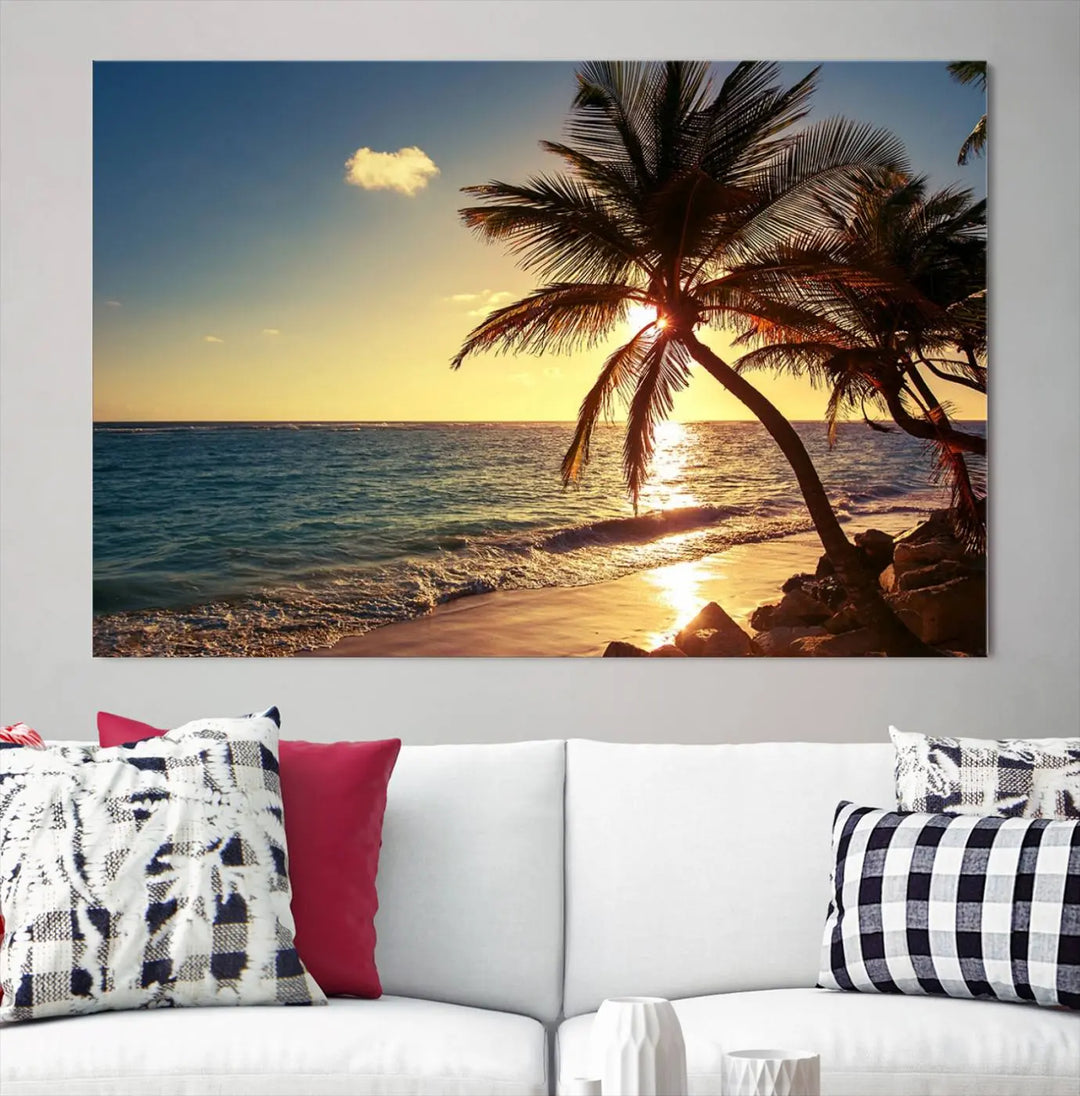 The Sunset Palm Trees Wall Art Canvas Print, a triptych masterpiece depicting a tropical beach sunset with palm trees, is expertly displayed on museum-quality canvases.