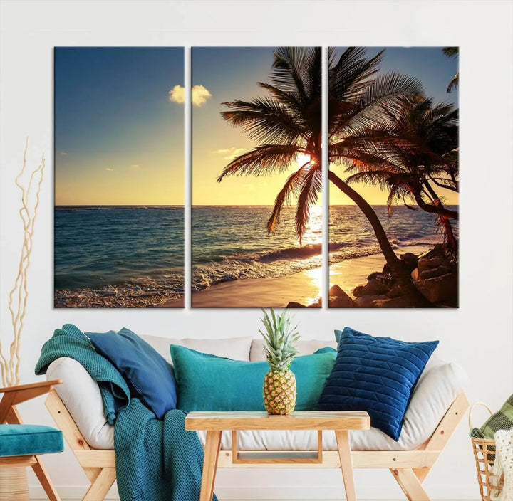 The Sunset Palm Trees Wall Art Canvas Print, a triptych masterpiece depicting a tropical beach sunset with palm trees, is expertly displayed on museum-quality canvases.